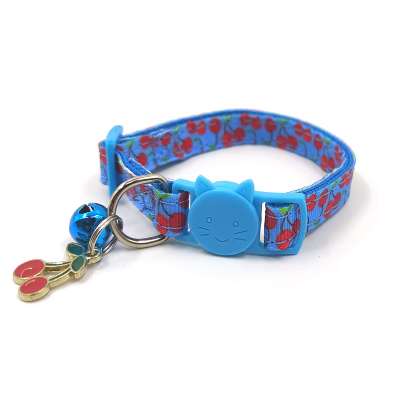Kitten wearing fruit print bell collar