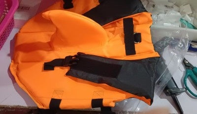 Close-up of shark fin design on dog life jacket